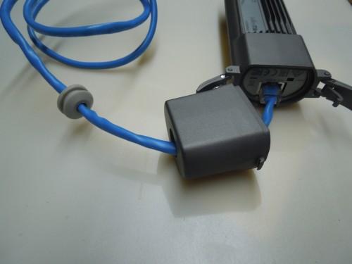 Rubber Gasket MUST be put in cable BEFORE the cable is inserted into the device. This is easily accomplished by stretching the gasket with a pair of needlenose pliers